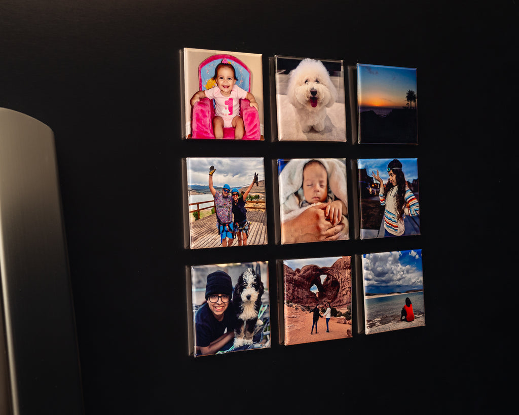 Nine custom photo magnets displayed in a 3×3 grid on a black refrigerator.