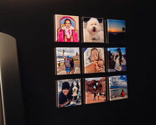 Nine custom photo magnets displayed in a 3×3 grid on a black refrigerator.