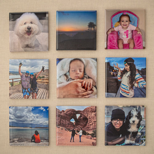 Set of nine custom 2×2 photo magnets arranged in a 3×3 grid on beige fabric.